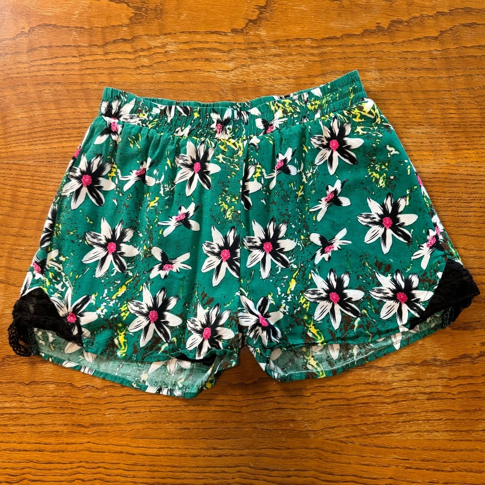 Green floral shorts with black lace trim